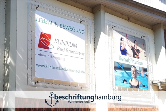 Werbeplane PVC Banner bedruckt mit Logo und Ösen Beschriftung Hamburg